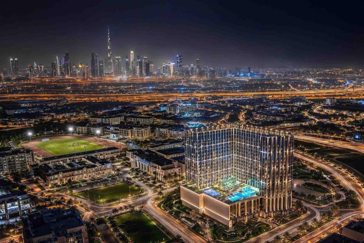 Binghatti Starfall, Al Jaddaf – aerial view at night with the Downtown Dubai skyline