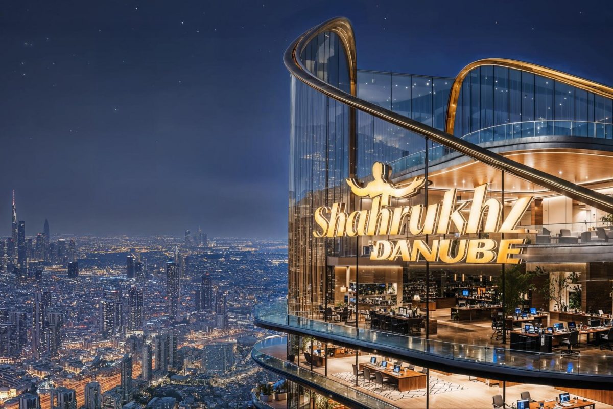 Shahrukhz by Danube – illuminated tower crown at night over the Dubai skyline